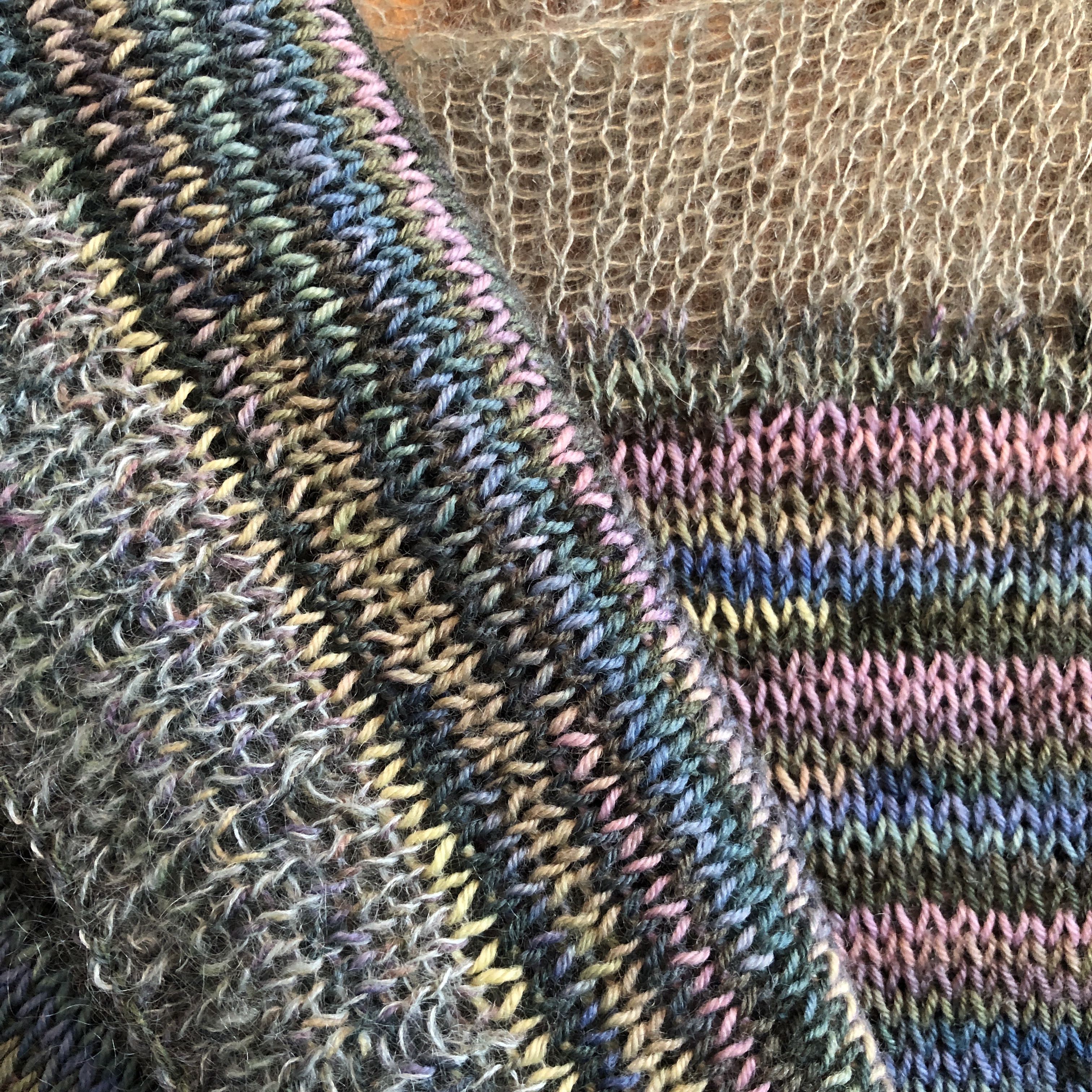 A closeup of the sweater showing off the different yarns. 